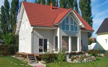 Modèle de maison bois "Tilleul" avec bardage en bois teinté